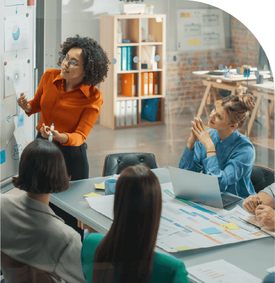 The team discusses business strategy in a meeting room