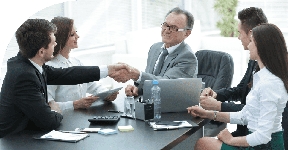 Team finalizing a equipment scheduling plan with a handshake