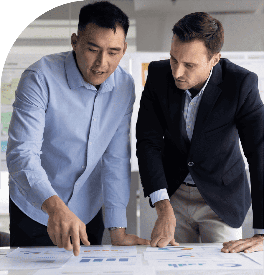 Business professionals reviewing charts and reports during a workforce planning discussion