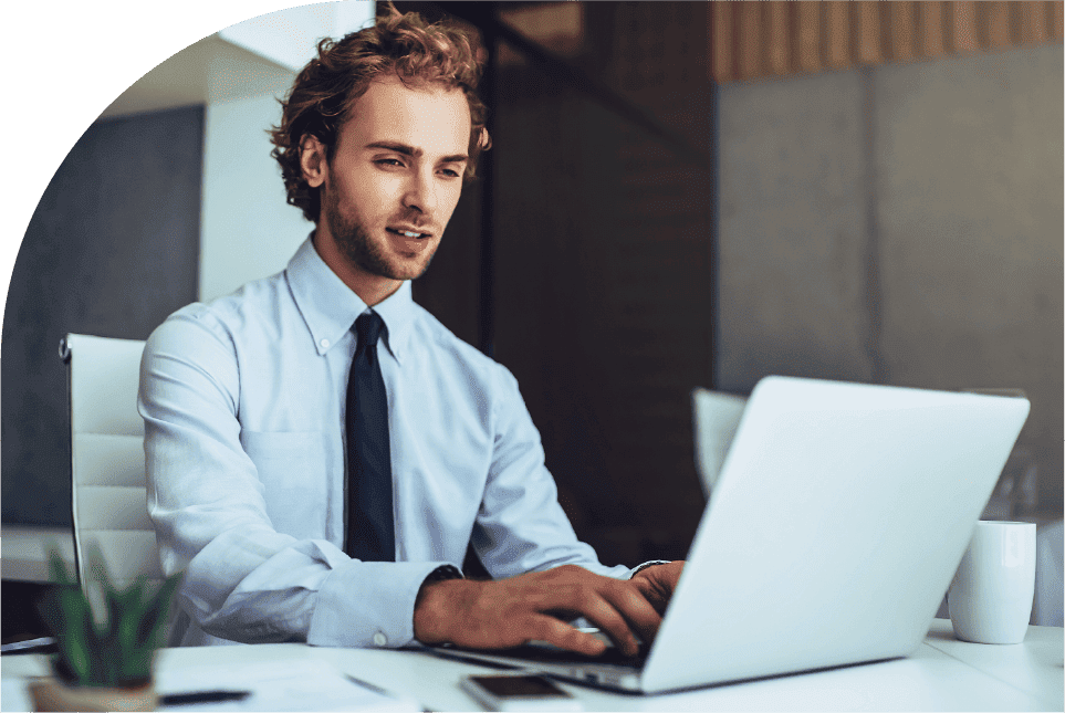 A project manager using a laptop to review project performance updates