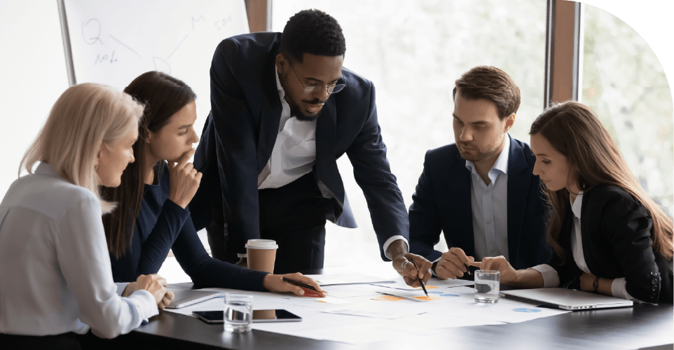 Business professionals discussing project portfolio reports