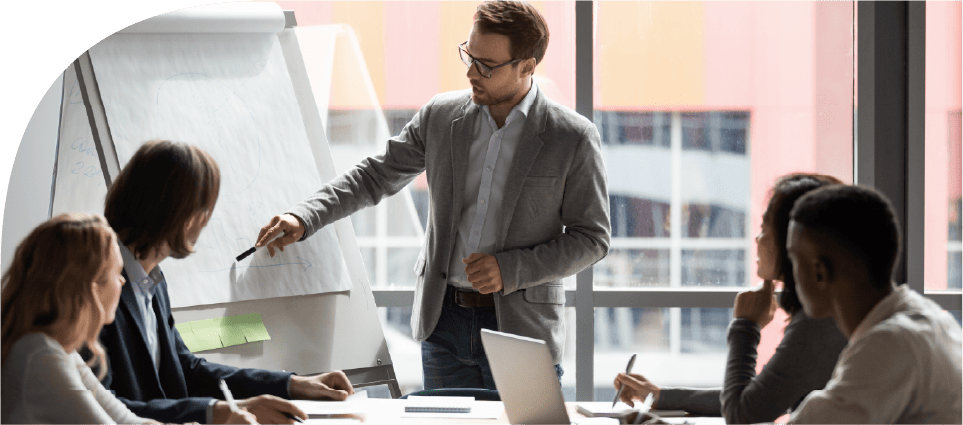 Business leaders discussing training scheduling in a meeting