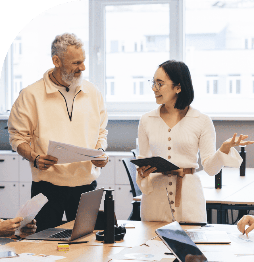 Business professionals discussing workforce schedules during an office meeting